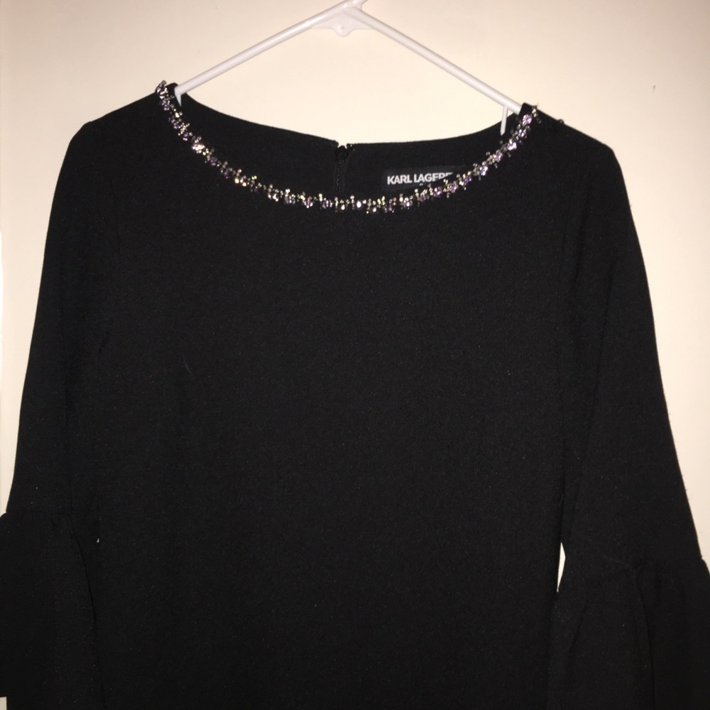 A black dress with crystals on the neck